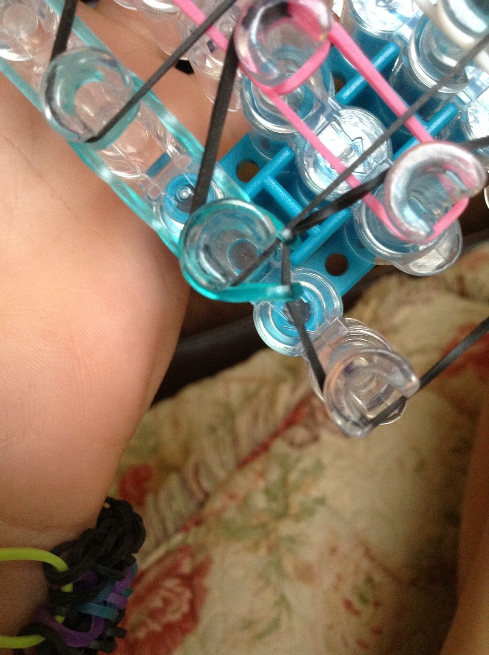 Push the bottom of the triangle back and hook the first row like a regular single, while pushing the bottom of the triangle back.