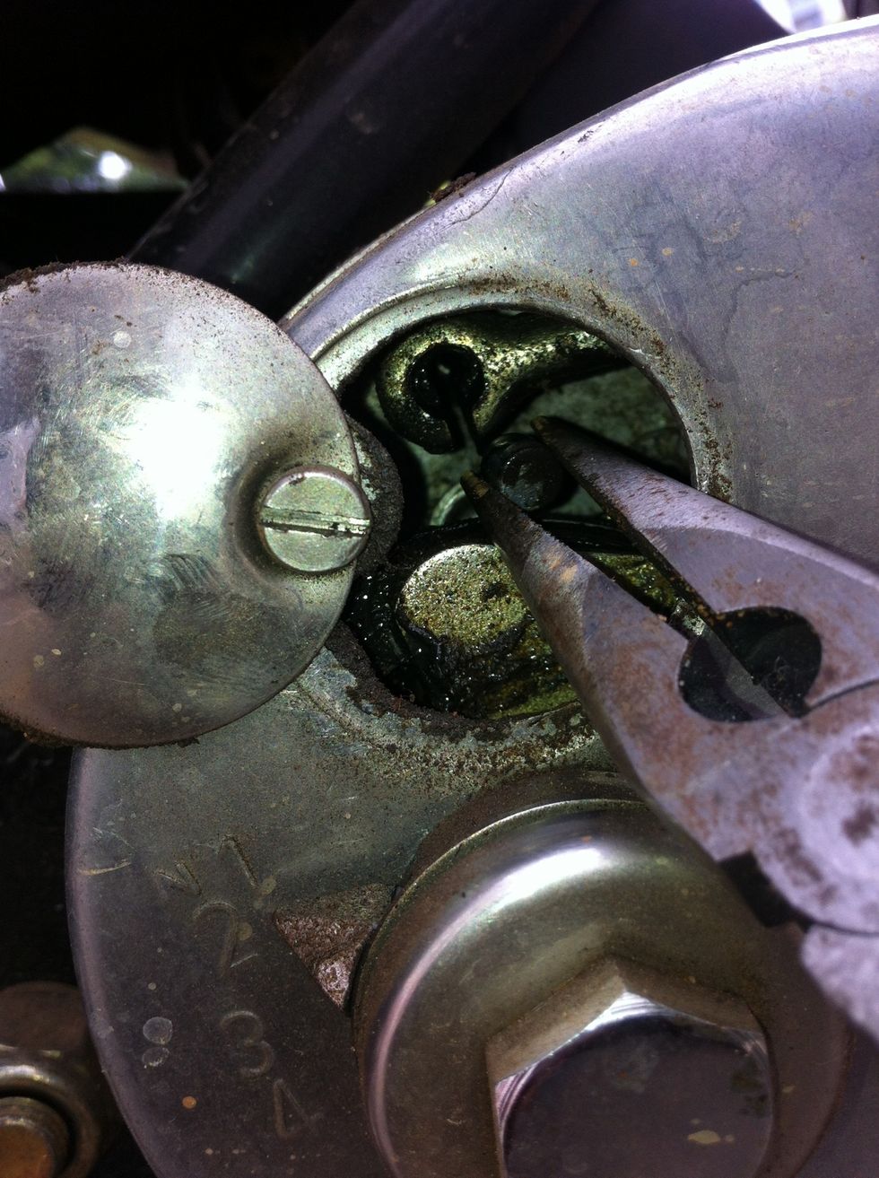 Push the cable out of the hook and move it backwards as much as you can