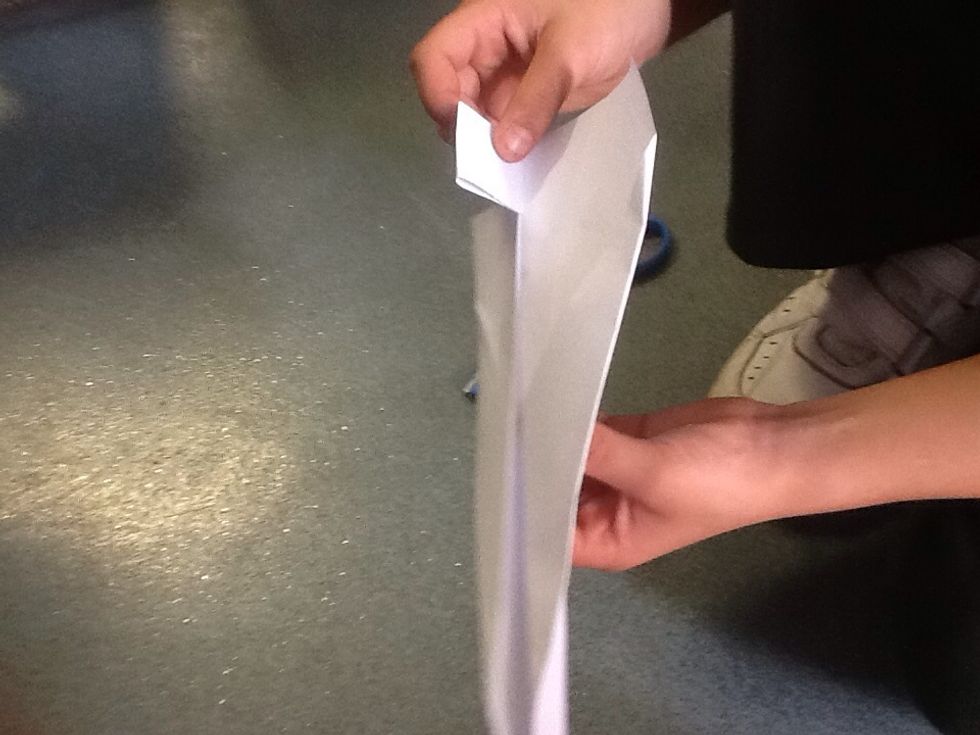 Push the cut tab upwards to make a tail.