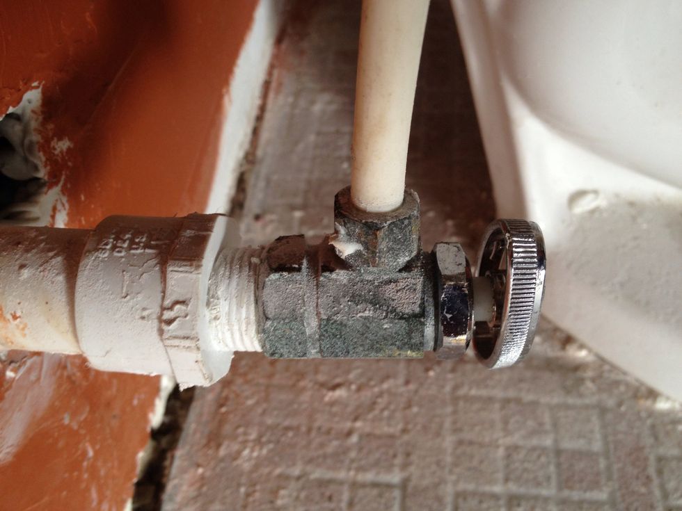 Push the end of the hose into the hole in the metal valve housing & tighten the collar down with a wrench. If it leaks, unscrew the collar, wrap some Teflon tape around the threads and reinstall it.