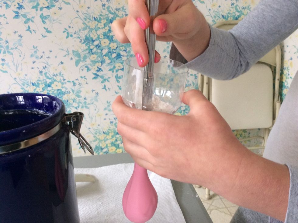 Push the flour into the balloon