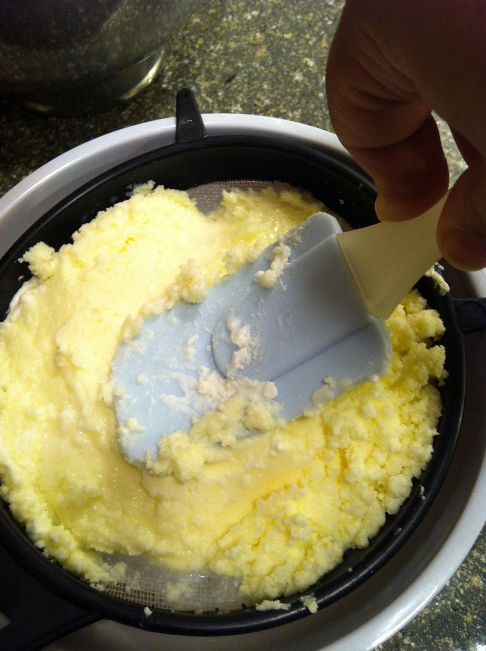 Push the liquid out. Get as much out as you can, liquid will cause your butter to turn rancid quickly. I don't recommend using your hands as it will melt the butter.