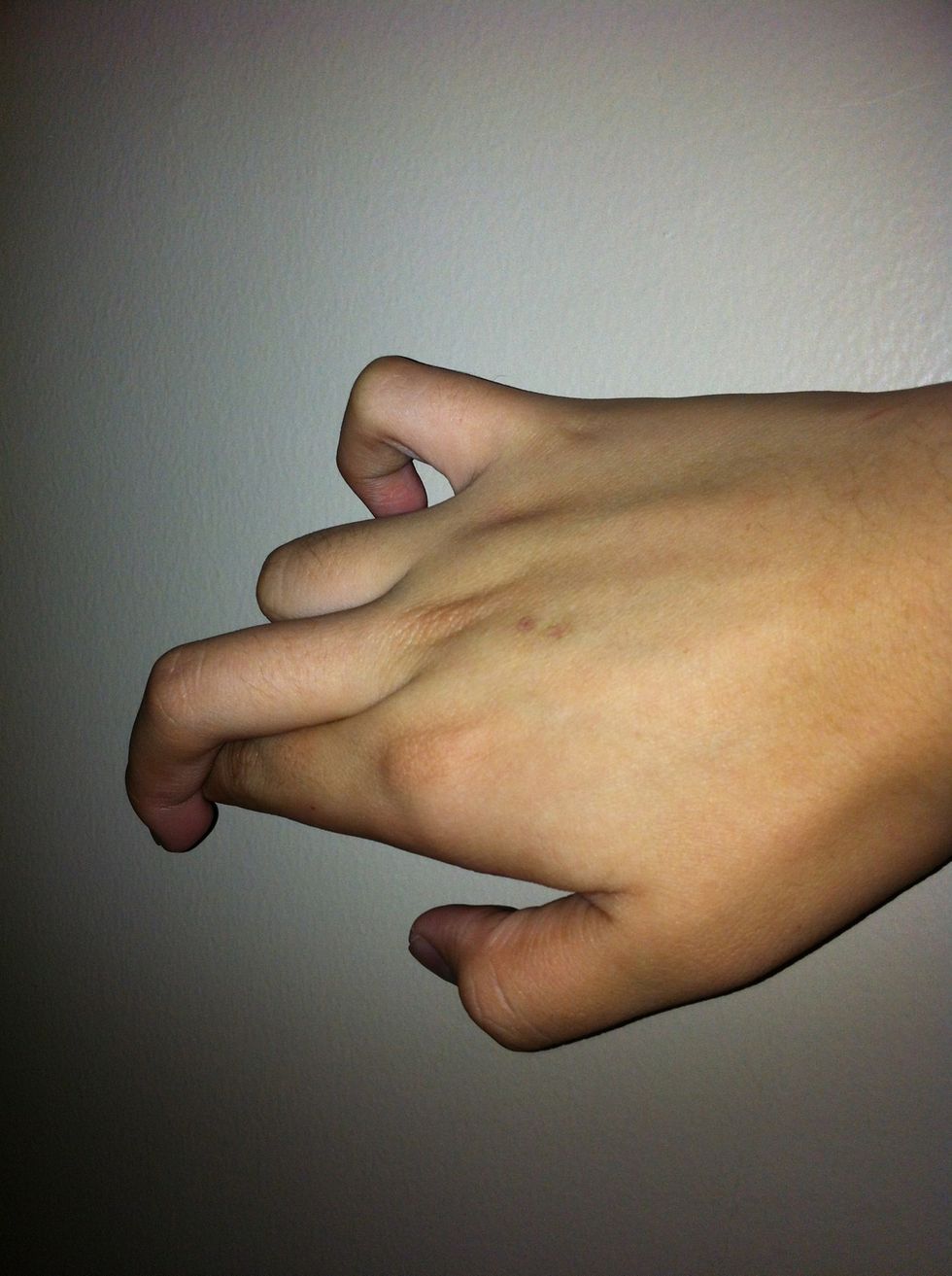 Push the minddle finger downward,and push first finger upward