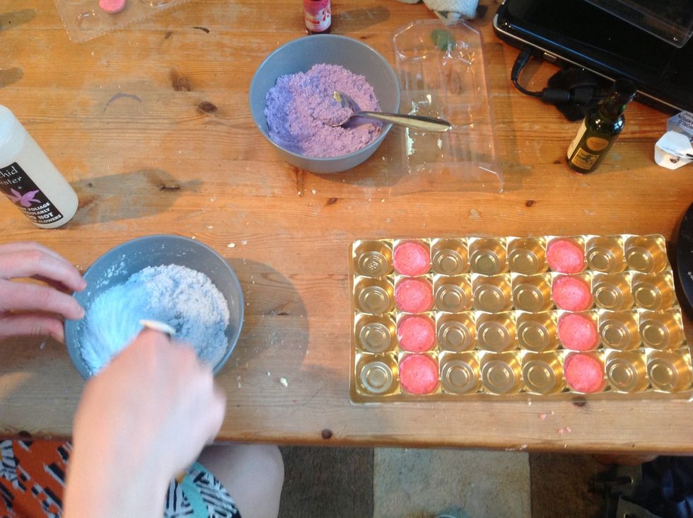 Push the mix still one at a time as hard as possible into your chosen moulds, them repeat the previous step followed by this one with each of the colours until you've used up all of your powders