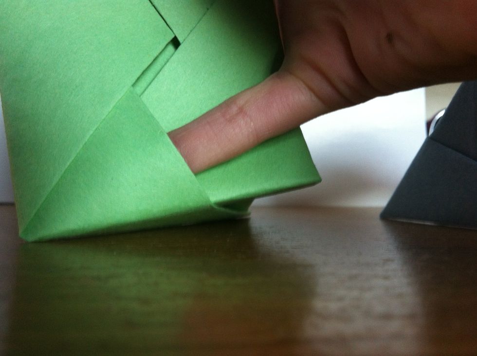 Push the other piece on through the small flap that my pinky is in.
