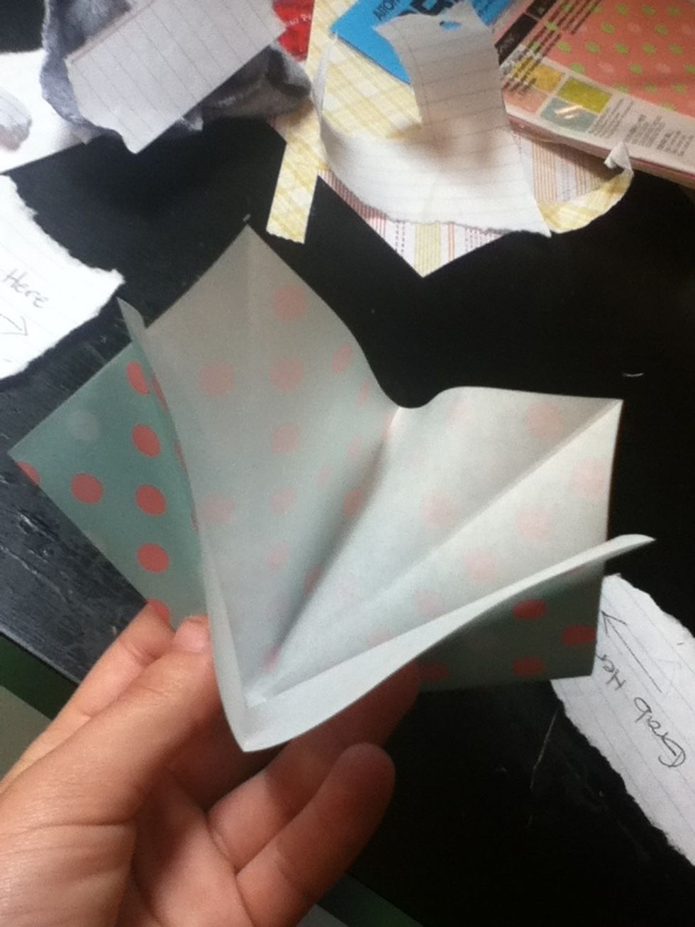 Push the paper in and it will start to fold.