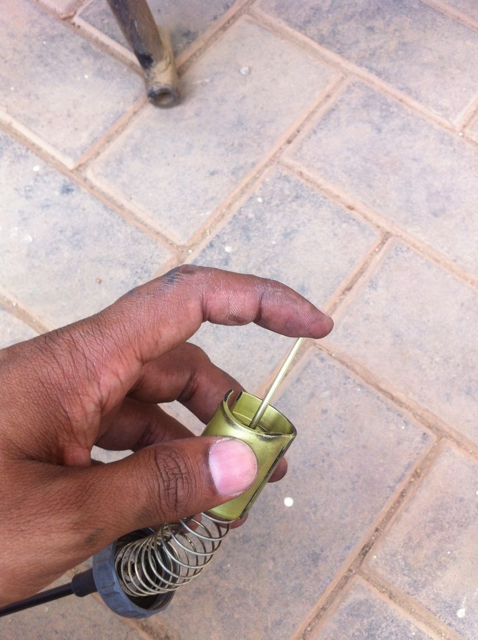 Push the pin down to release the clip.