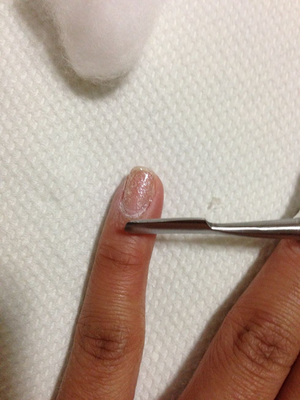 Push the soften Shellac nail polish with the nail pusher. (Push just the soften nail polish. Don't scrape too hard, so you keep your nails smooth)