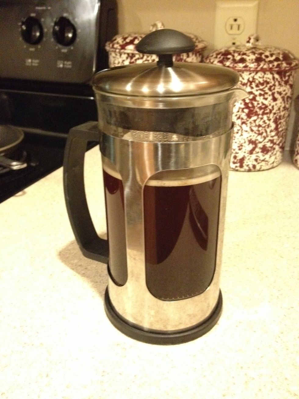 Push the strainer all the way down slowly.