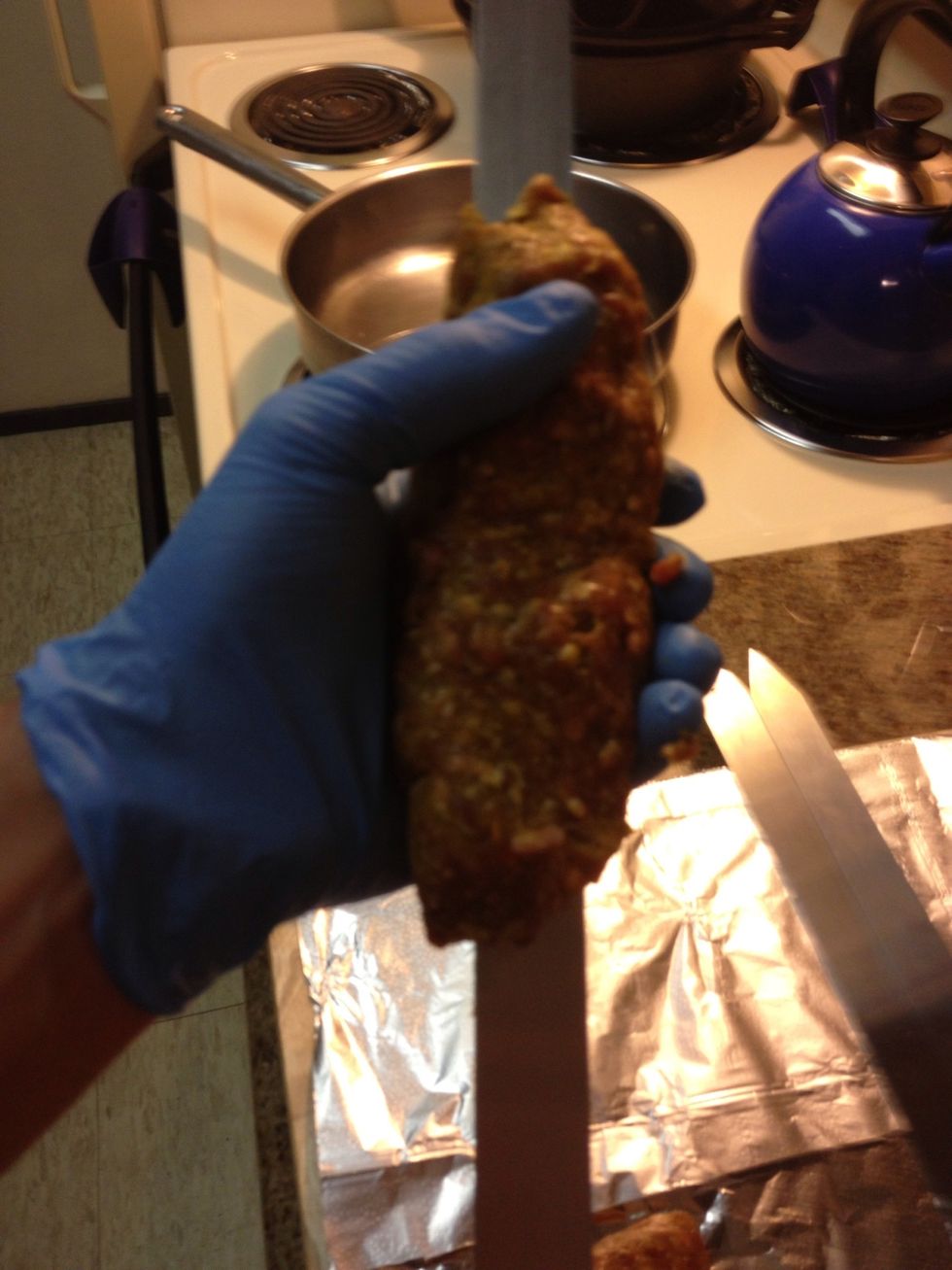 Push the sword into the meat 6" from the top and start working your way down squeezing the meat evenly as you go. The finished kabab should be at least 12" long if you thinned it out enough.