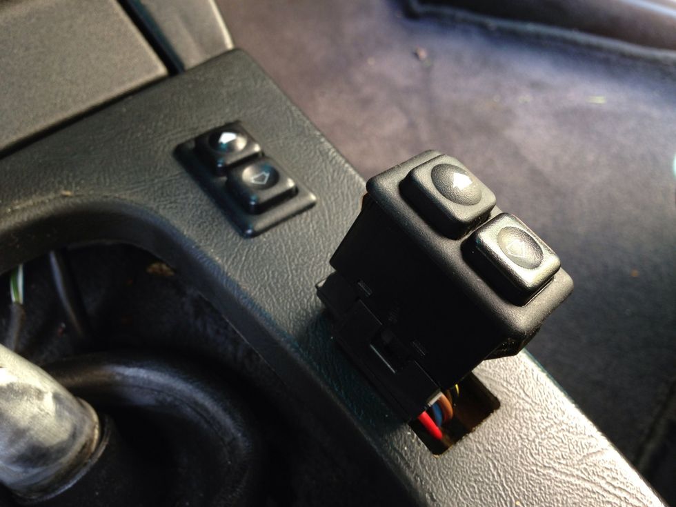 Push the window switches up from the bottom until they come out. They sometimes might be in there rather tightly so you may have to use some elbow grease, but be at your own risk.