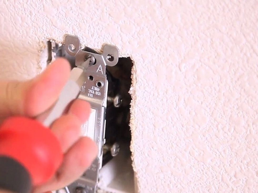 Push the wires back into the junction box.