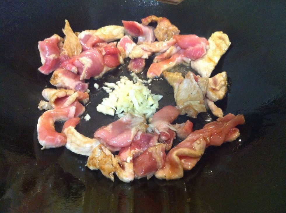 Push them to the sides and add minced garlic and sambal olek. Becareful not to burn it. Keep stirring or agitate the wok.