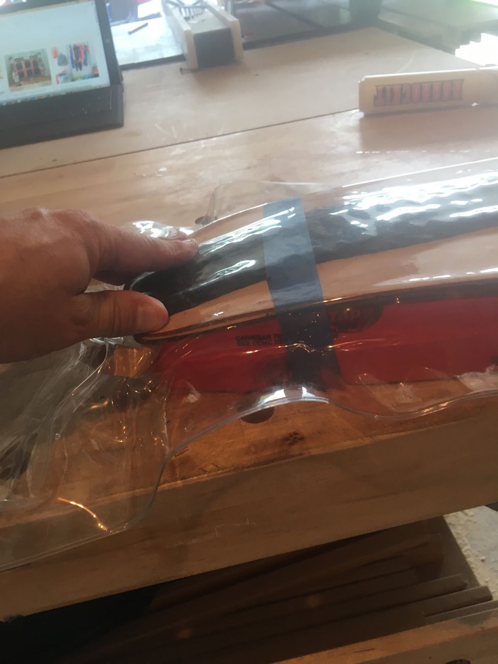 Push veneers into foam mold as air is removed from the vacuum bag.