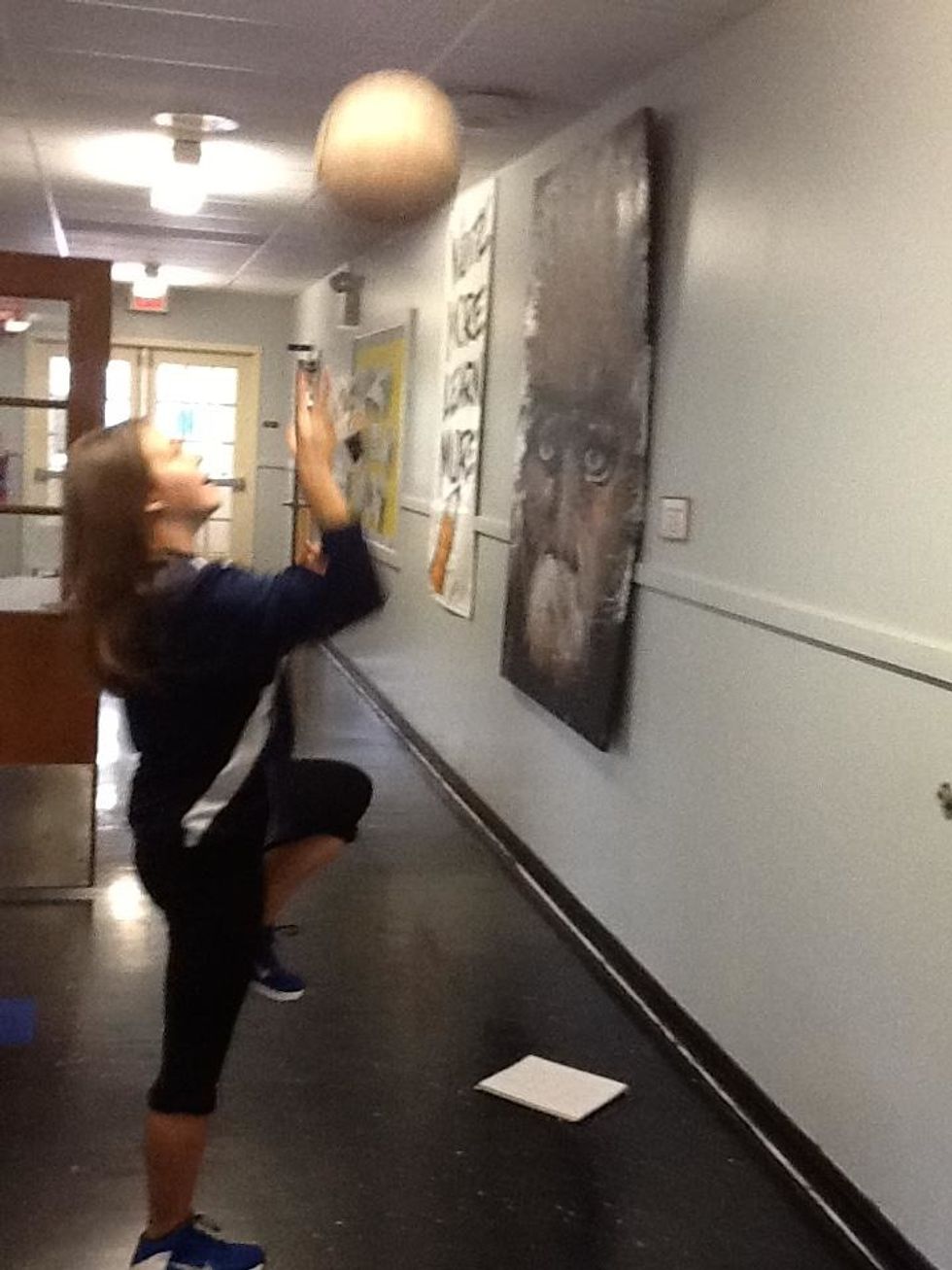 Push you arm up with the ball and DON'T SHOOT WITH BOTH HANDS!!