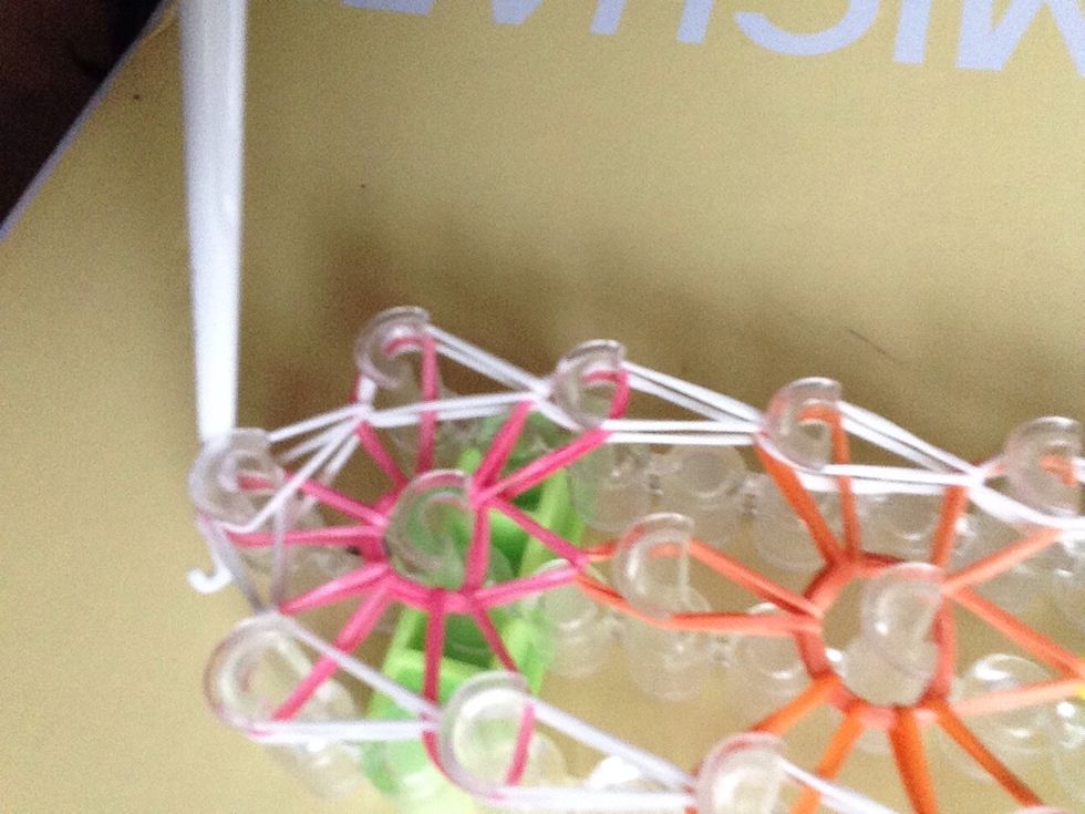Push your hook through all of the bands at the top. Which would be color 1 the very first star you made.