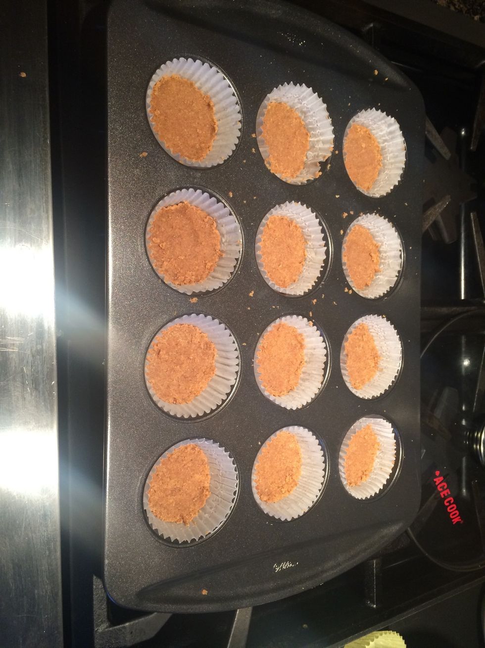Put 1 1/2 teaspoons of the mixture into the bottom of the cupcake liners and press down firmly