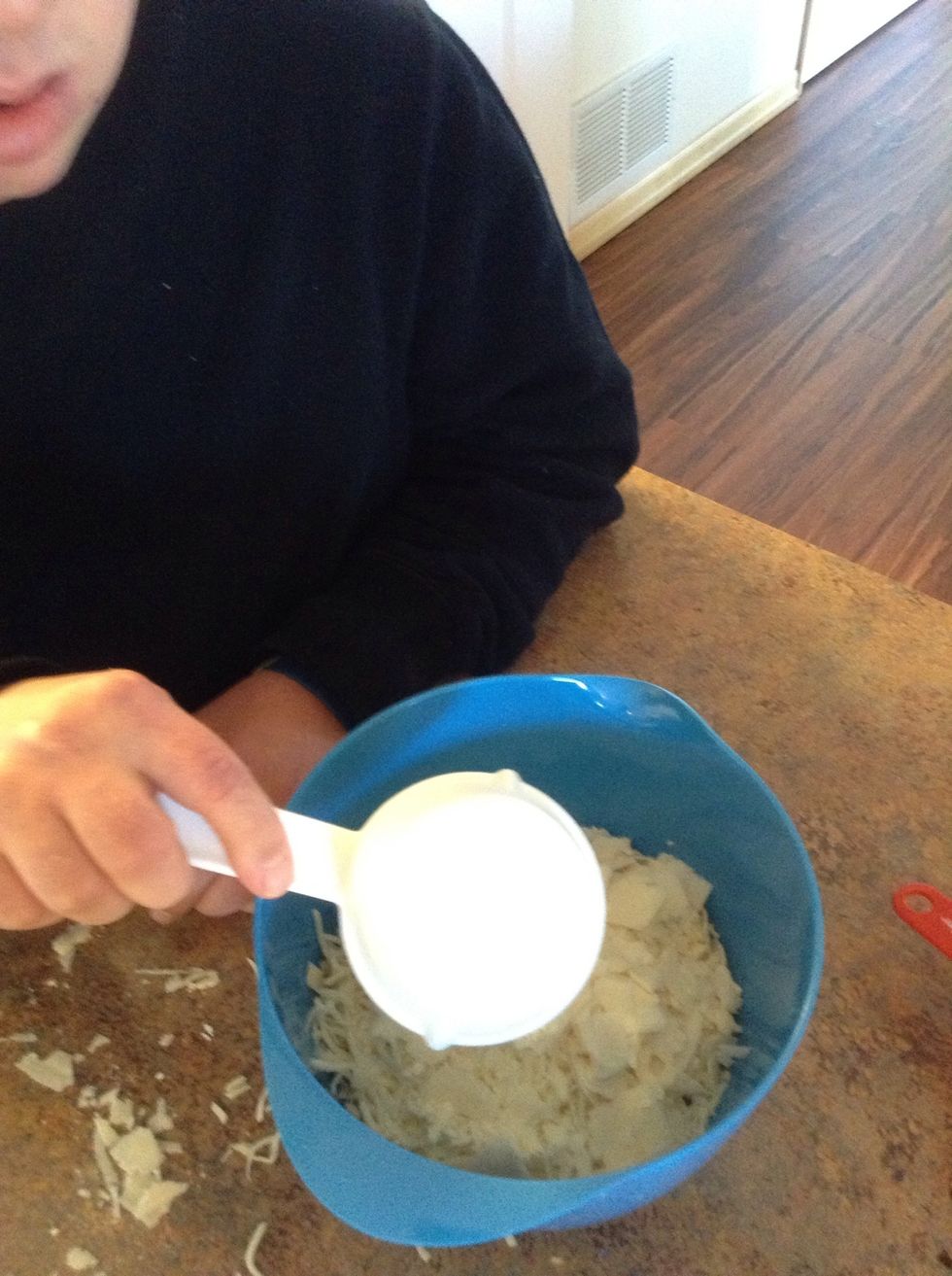 Put 1/2 cup Parmesan cheese into bowl.