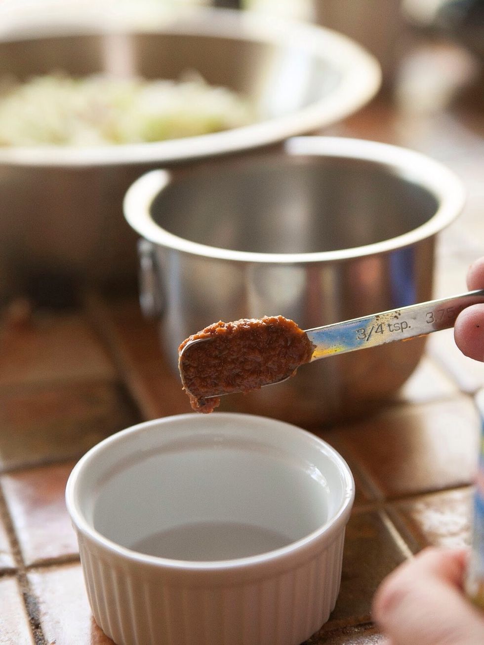 Put 1 and 1/2 tsp of tamarind paste into a small bowl.