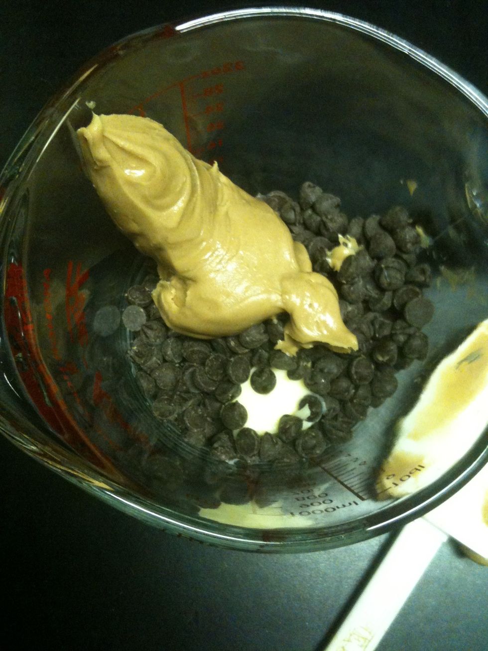 Put 1 cup of chocolate chips, 1/4 cup of butter, and 1/2 cup of peanut butter into a microwave safe bowl.