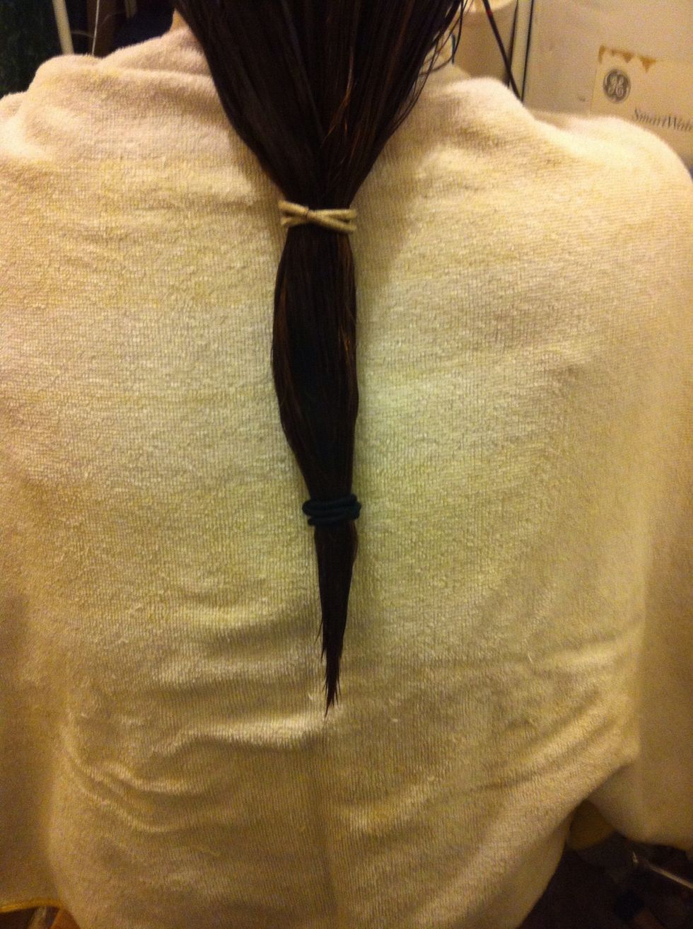 Put 1 hair tie about midway down and the second hair tie where you want to cut.