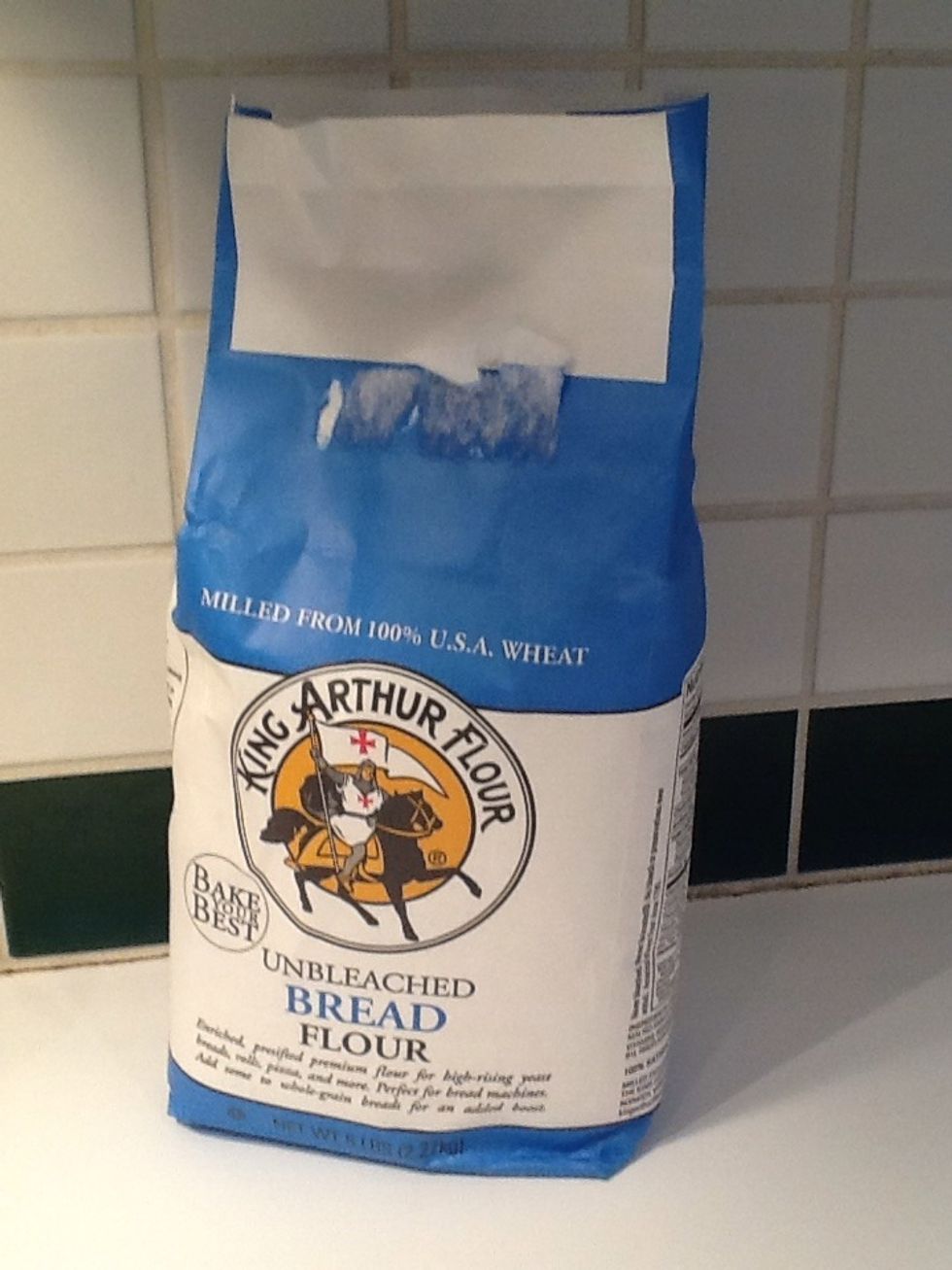 Put 2 1/2 cups plus 2 Tbls. flour (12 oz- I did the math and wouldn't it be easier to just weigh it?) into the tub.