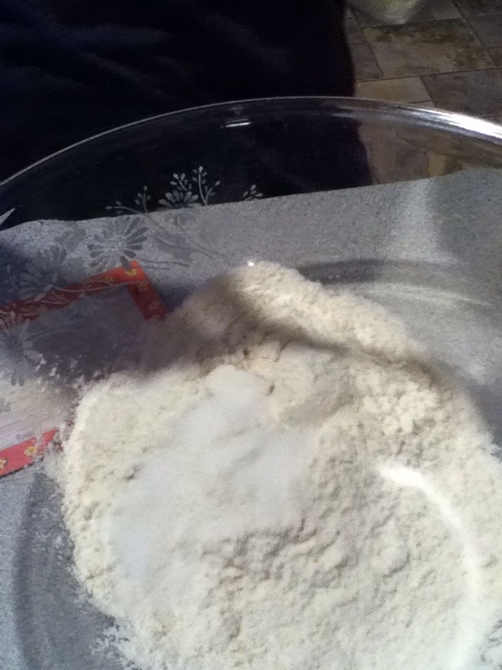Put 2 cups of flour and 1 teaspoon of salt into the mixing bowl.