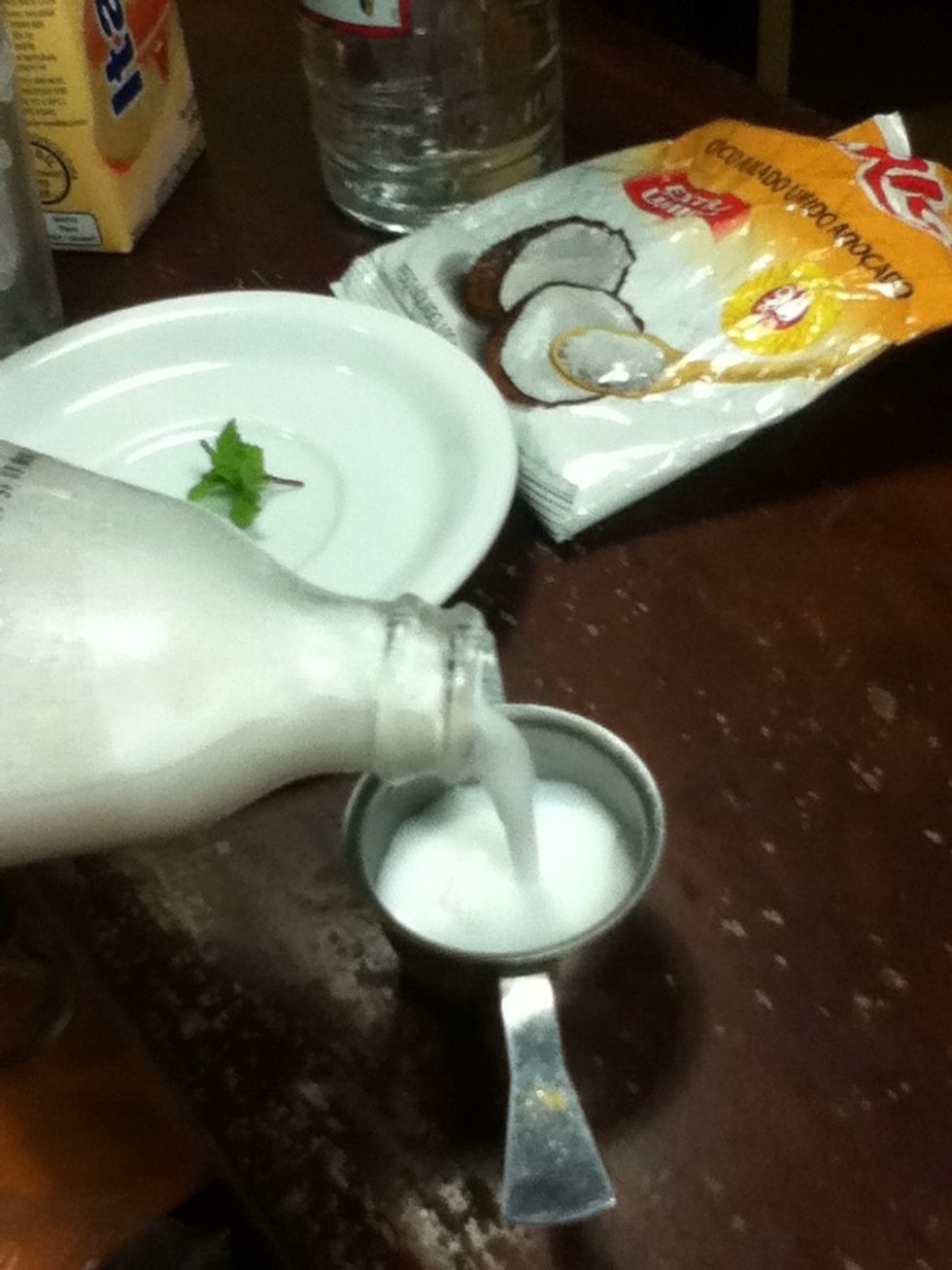 Put 3 doses (150ml) of coconut milk...