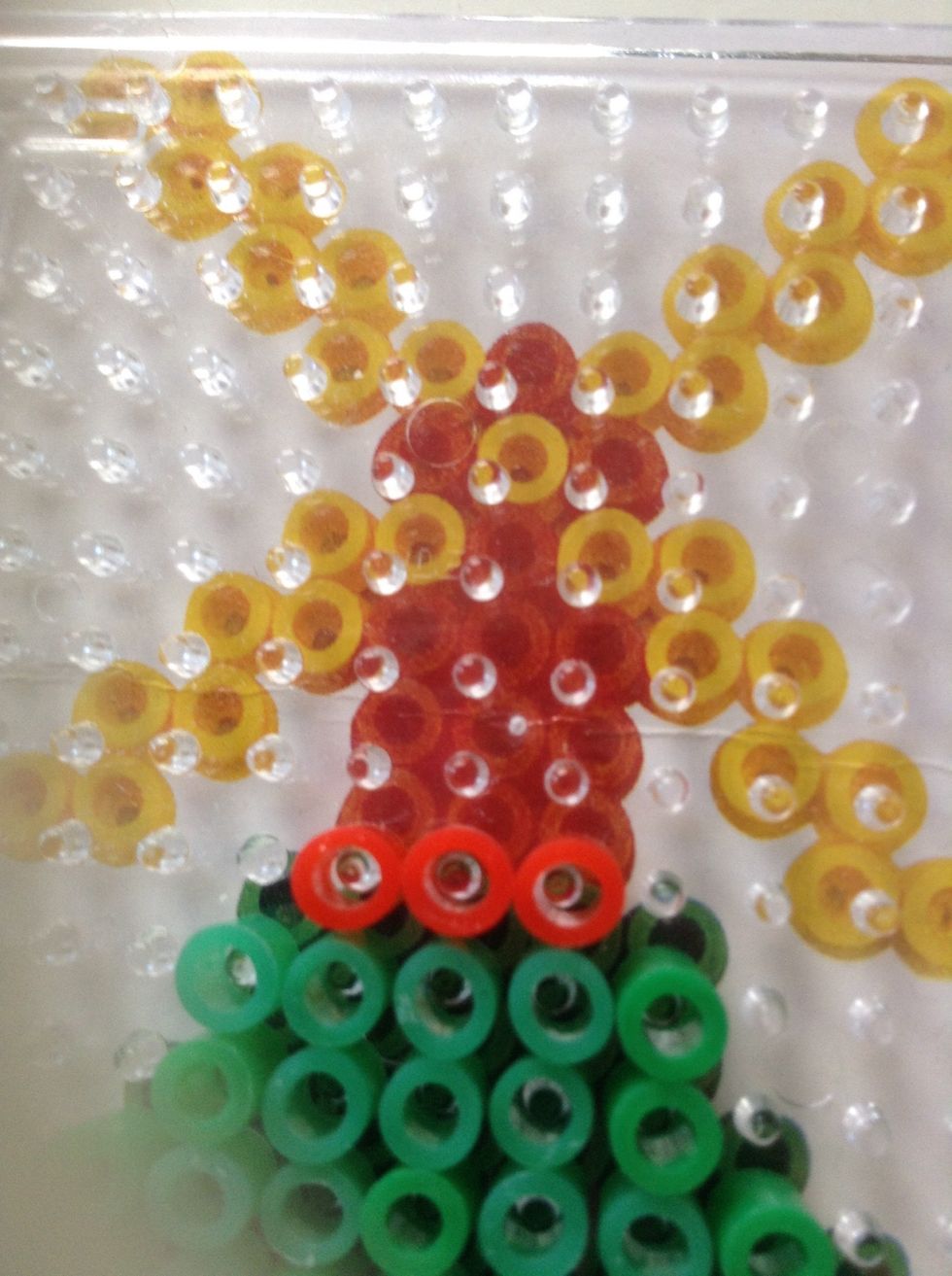 Put 3 red beads on top. Do two more please.