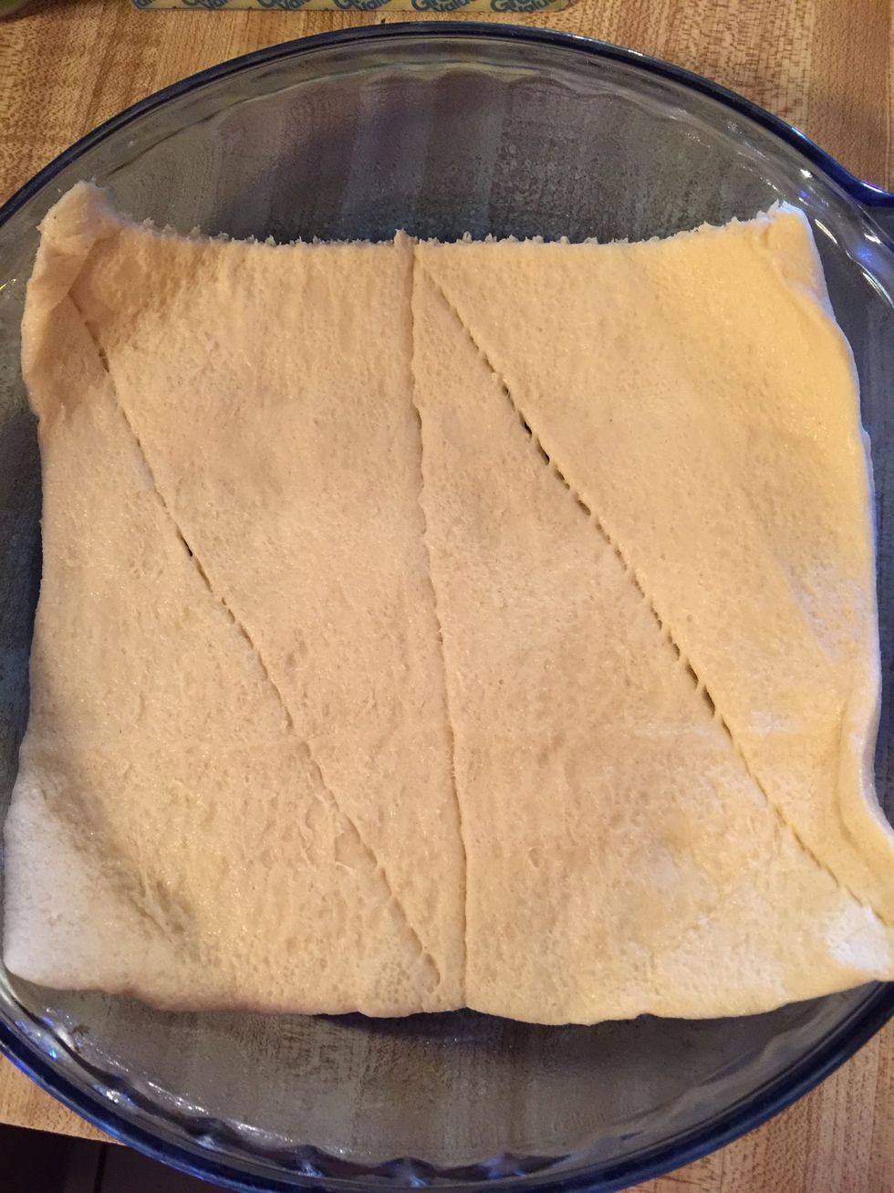 Put 4 rolls in pan. I sprayed with Pam to coat pan. I used a round pan but you can use a 8x8 square pan.