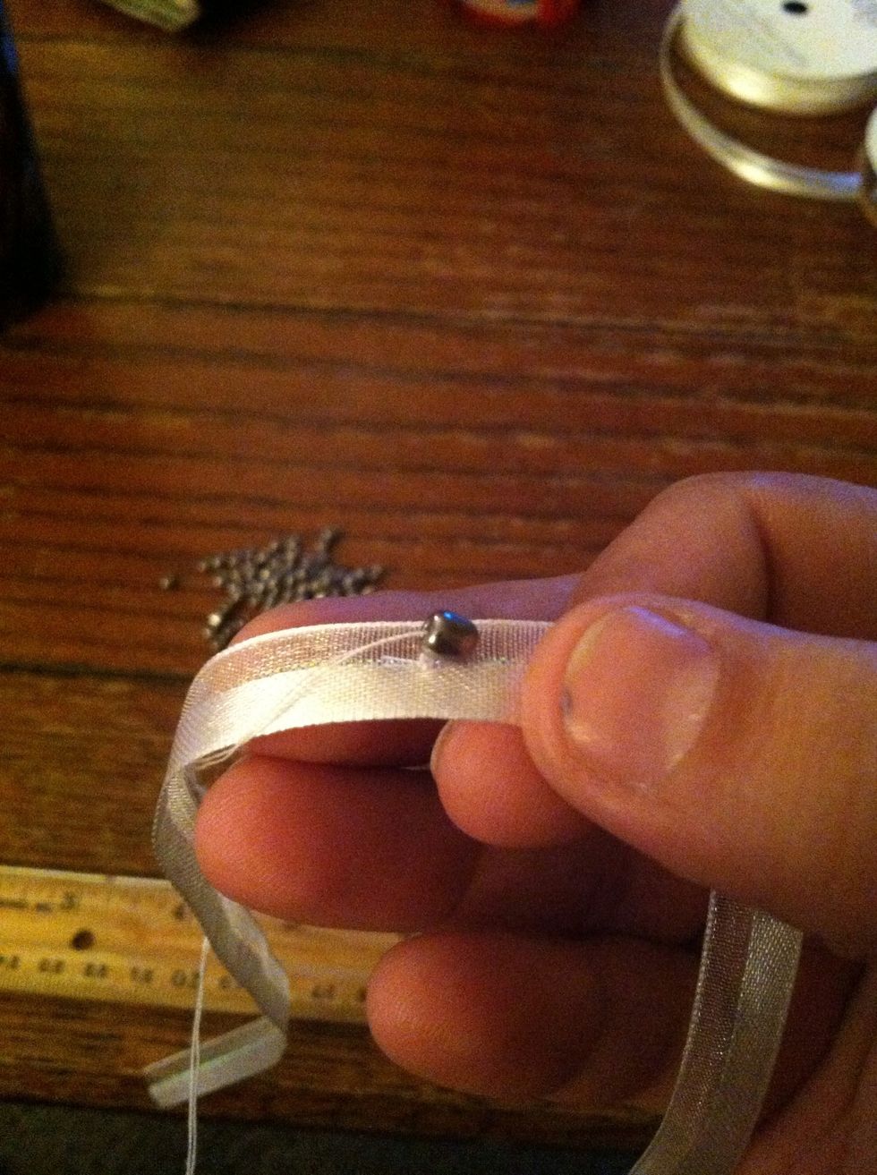 Put a bead on the needle tip. **trust me about pulling it through, I made this mistake even though I knew better and it's much harder.**