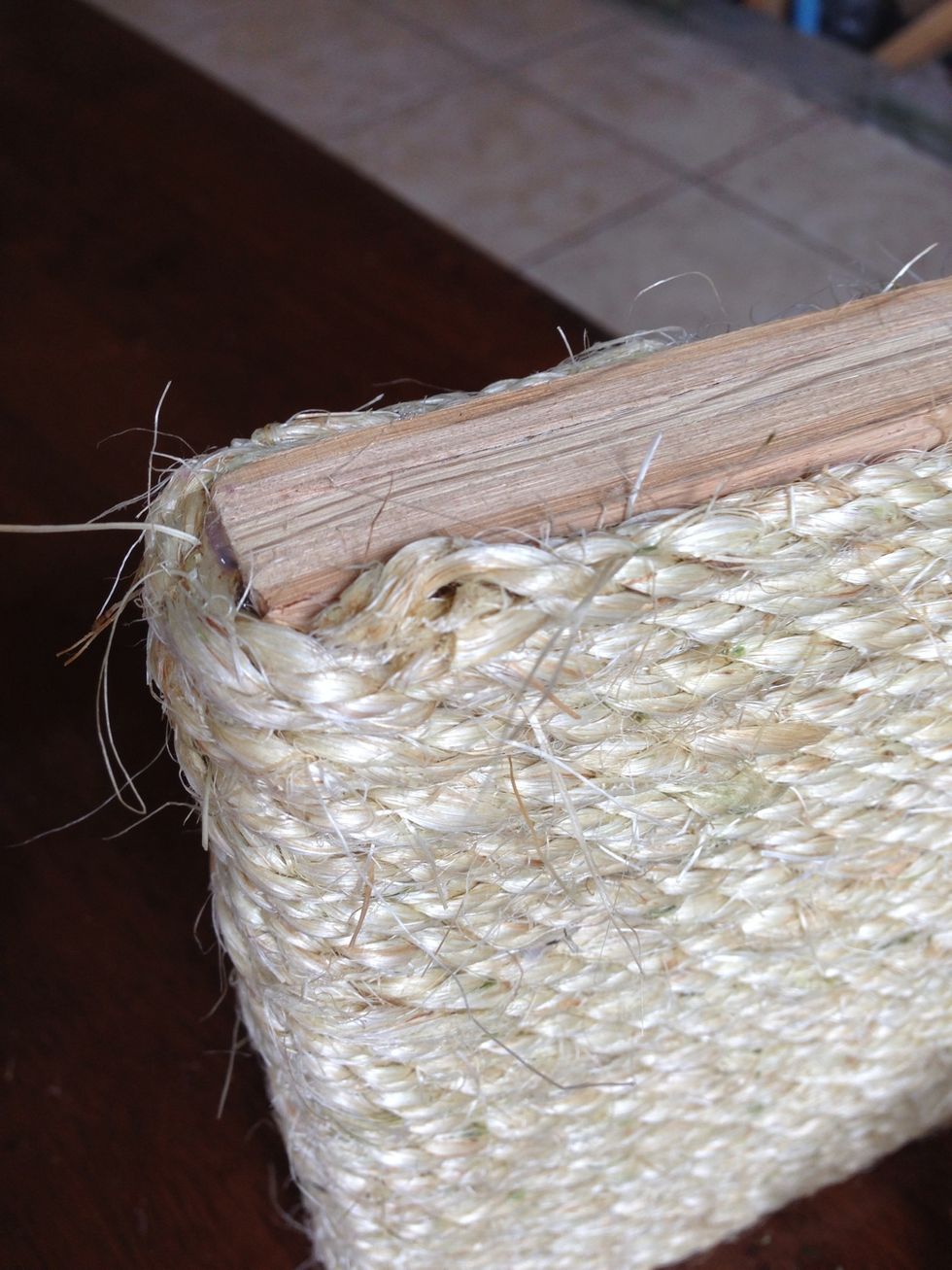 Put a blob of glue on the end of the rope you just cut, and smear it around some. You want to make sure all your loose edges are tucked away.