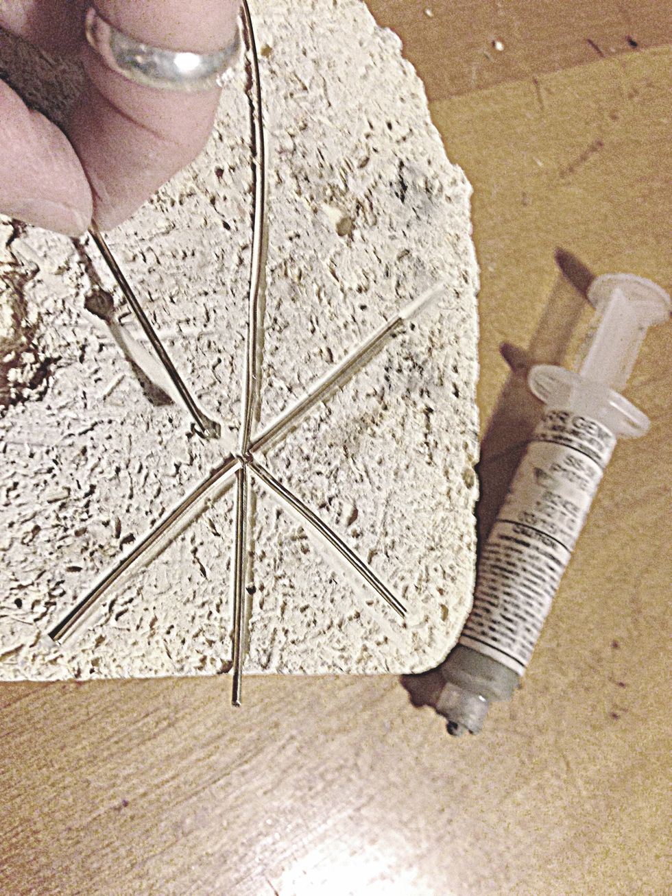 ...put a blob of silver solder paste on the end and lay it in place with the other spokes.  The excess silver solder is normally a bad thing, but it will lend a rustic appeal to this project.