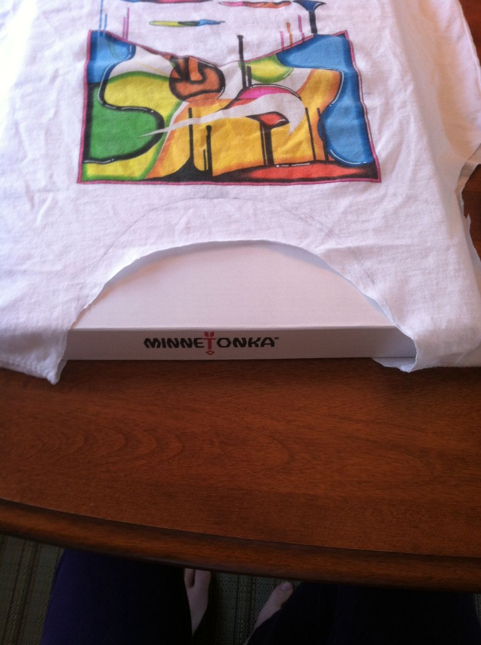 Put a box in the shirt so you only cut the top/front.