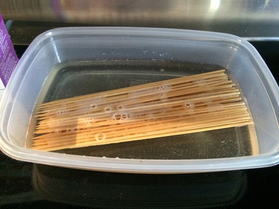 Put a bunch of skewers in water to soak. An hour or two in enough time. Once before I soaked them in Jack Daniels and they turned out tasty.