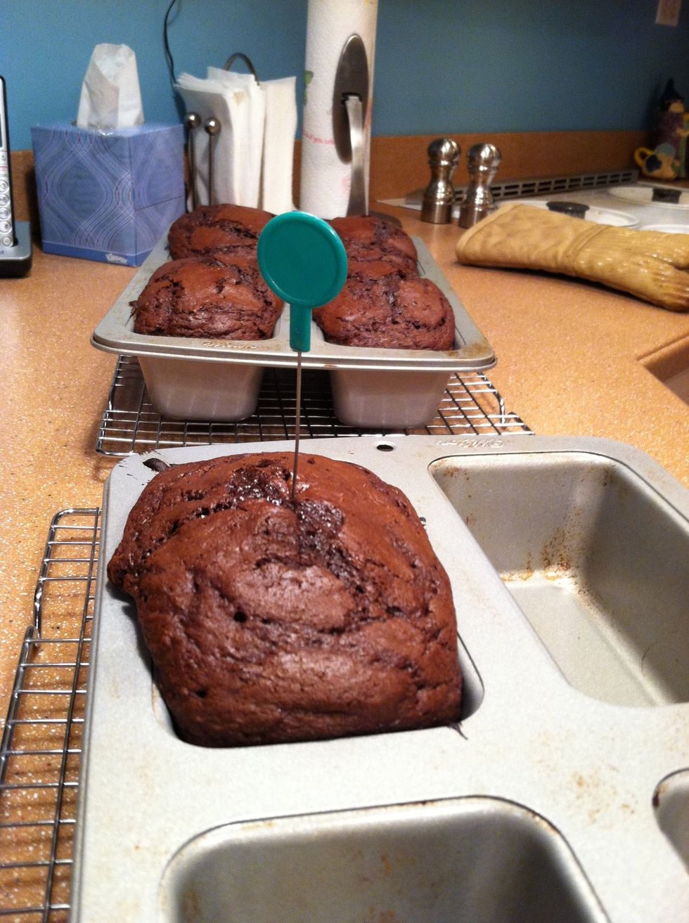 Put a cake tester in and if it comes out clean take it out of the oven! Let it cool for 1 to 2 hours or overnight!