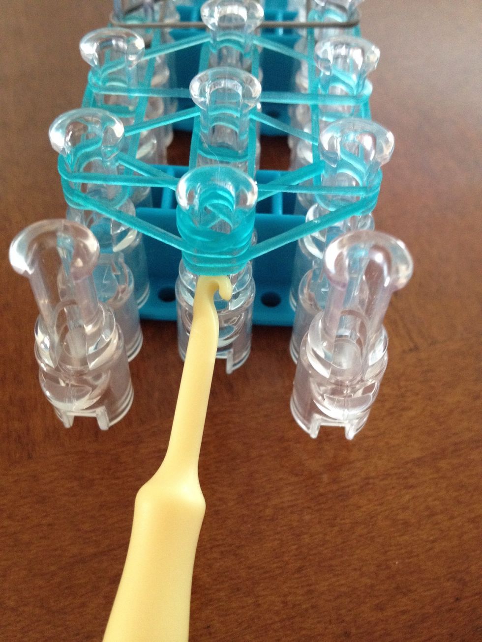 Put a capping band on the very last peg (center)