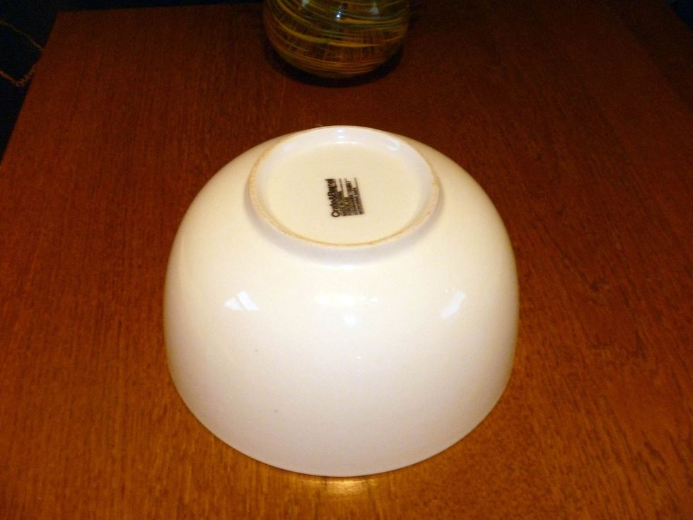 Put a ceramic bowl upside down on a table, it is better if the bowl bottom about the same size as the center portion of your vinyl record.