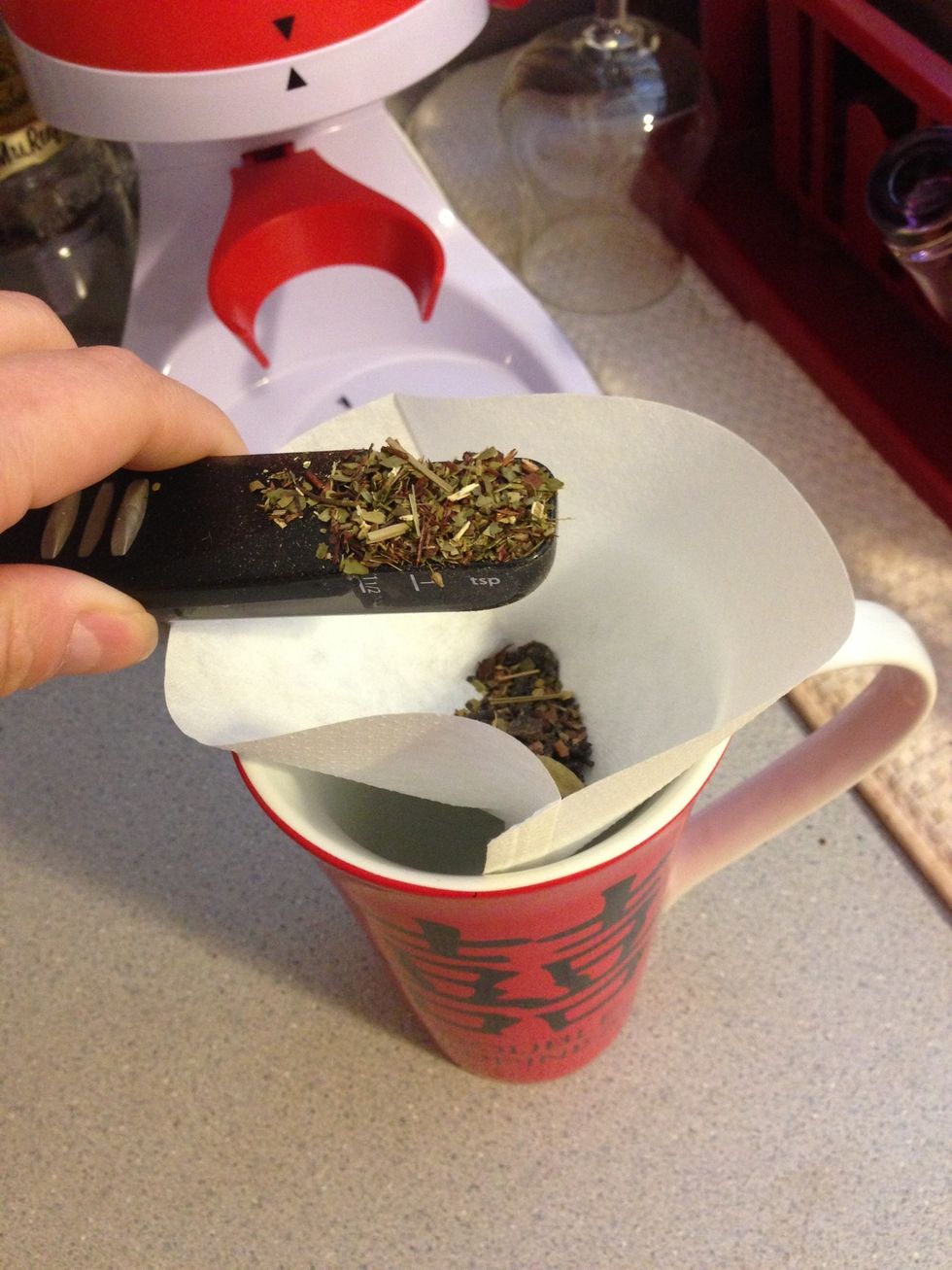 Put a coffee filter around the rim or use a tea ball. Put the recommended measurements for your loose tea for iced tea. Since I am mixing, I did 1 tsp of chai oolong and 1 1/2 tsp of chai matte.