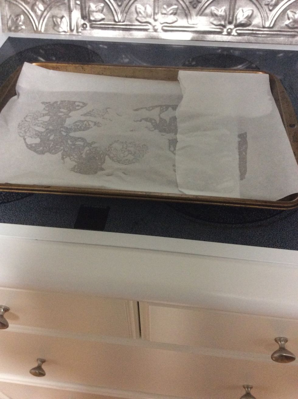 Put a cookie sheet down on your pan