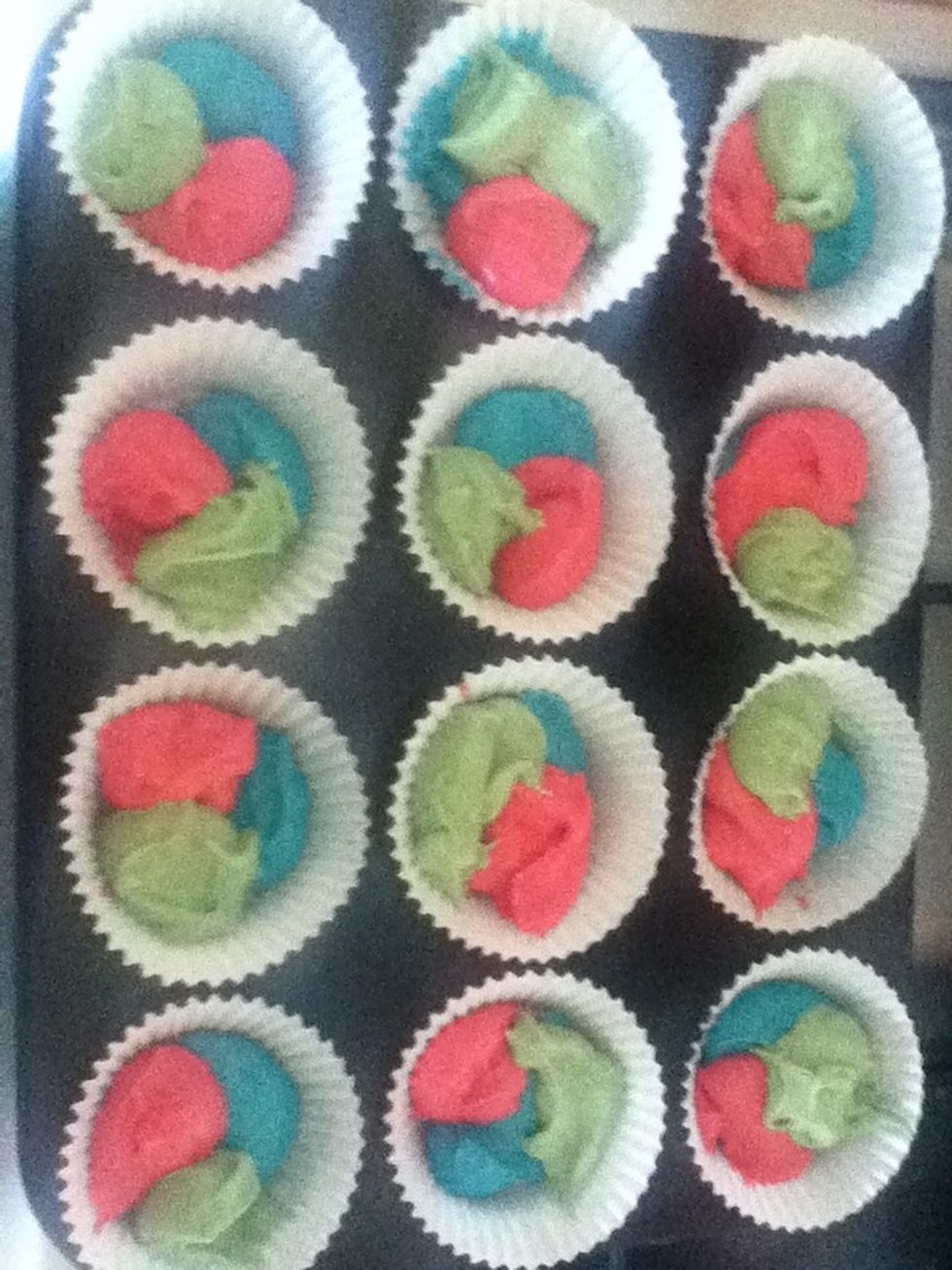 Put a dollop of each colour in the bun cases