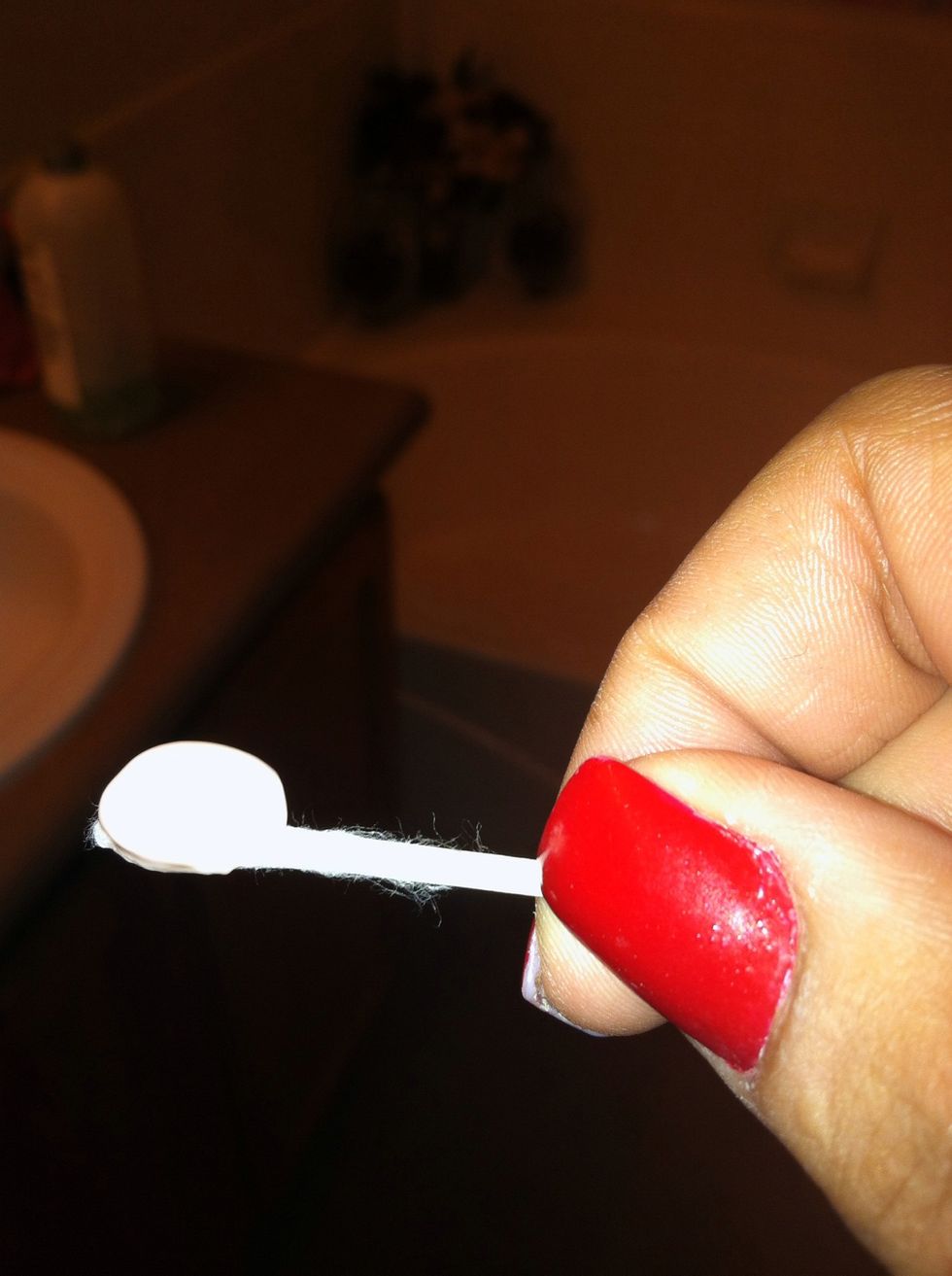 Put a dollop of Nair on top of Qtip.