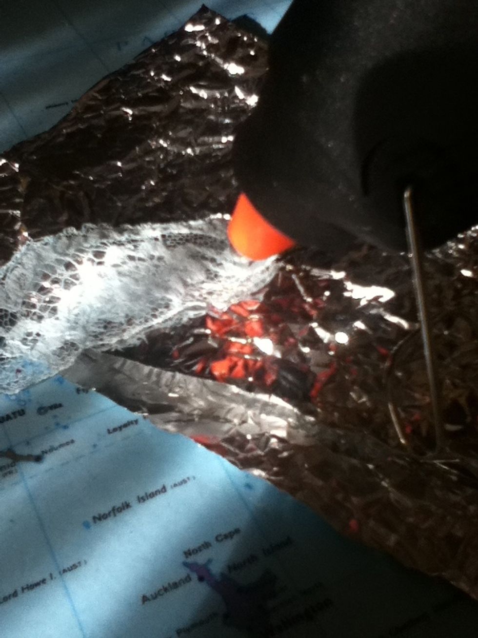 Put a dot of hot glue on the end of the ribbon