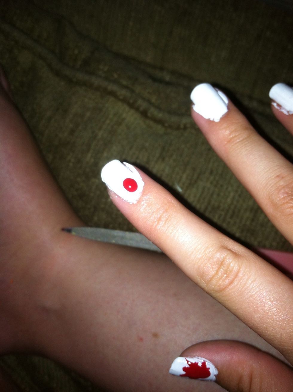 Put a dot of red nail polish on your nail. Male sure there's a lot. :)