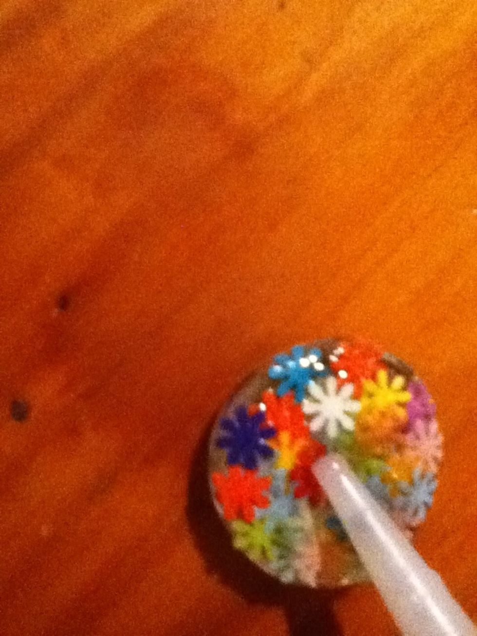 Put a drop of glue in the center.