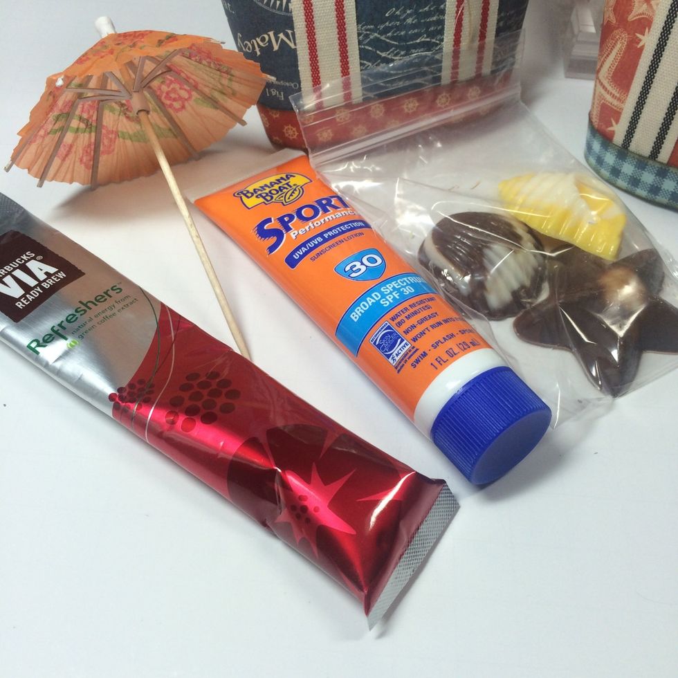 Put a few Summer themed goodies in the totes like a sunscreen, drink mix, sea shell chocolates, and a drink umbrella.