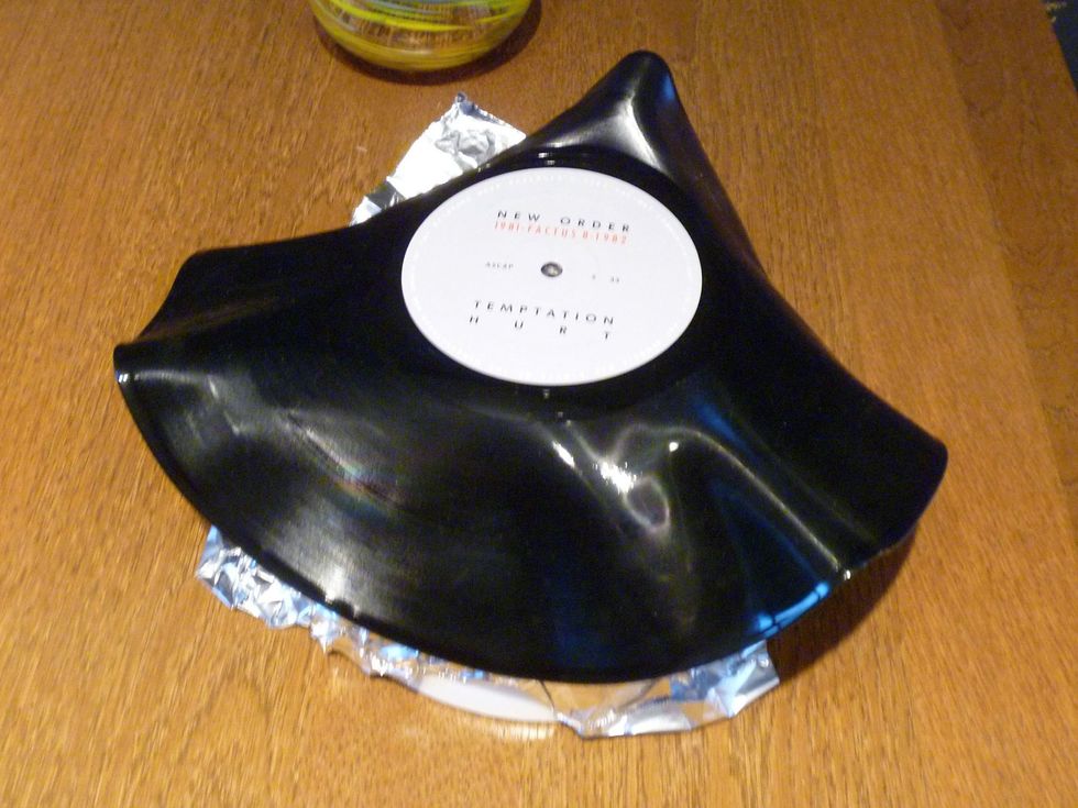 Put a foil paper over the bowl and simply lay down the record over the top.