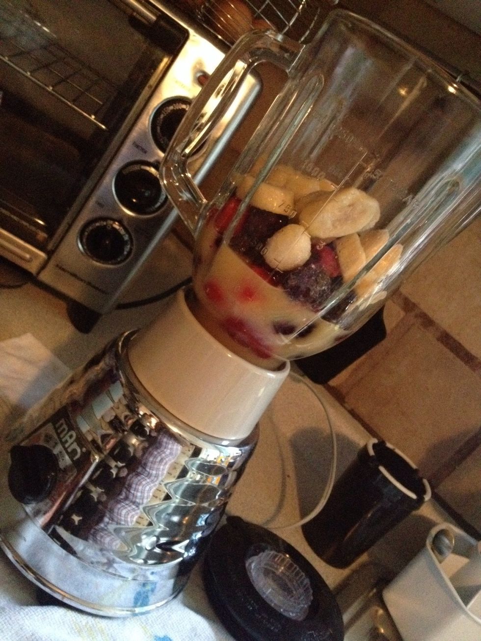 Put a handful of berries (mixed) and about one entire banana in the blender with 300 ml of orange juice approximately.