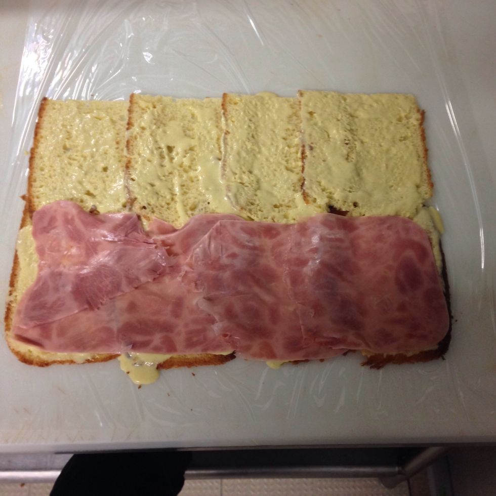 Put a lair of ham all over the bread