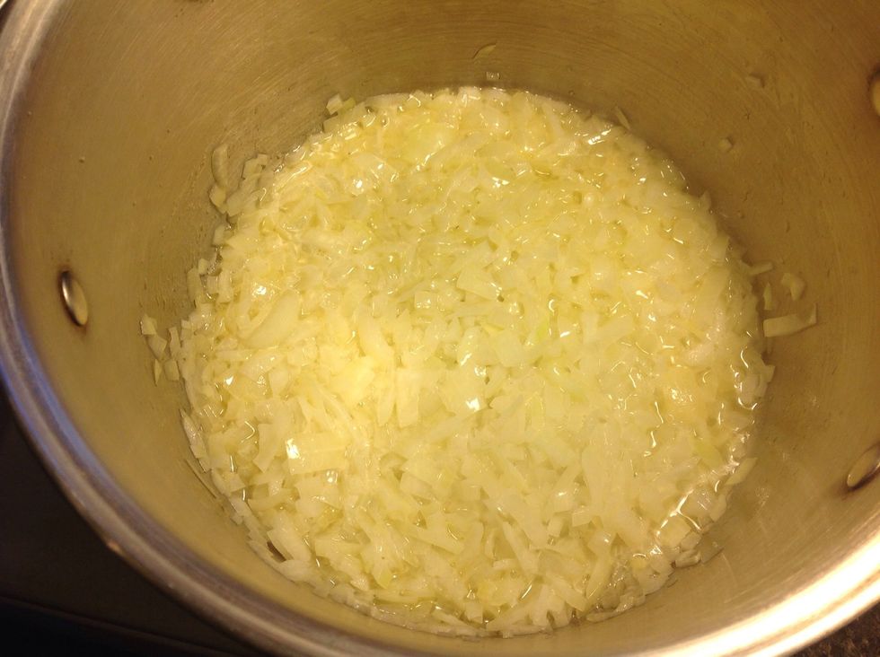 Put a large pot on medium to low het, melt the butter in the pot then add the onions, garlic, salt and white pepper then cook for 4-5 minuets or until soft. stir occasionally.
